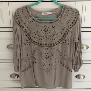 Unique top with embroidery and cut outs!